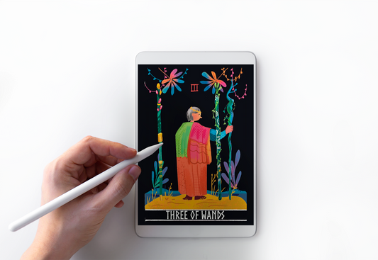 A person designing a tarot card