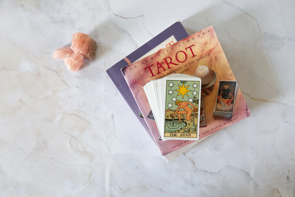 A book with tarot cards on top of it