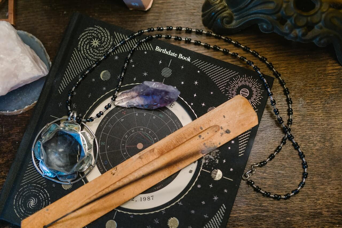 Incense holder on top of a astrology mat