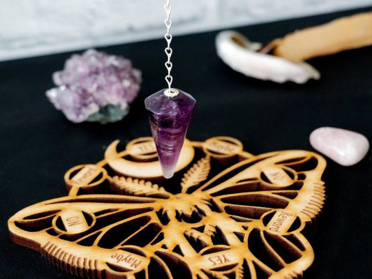 moth pendulum board with moon phases and amethyst