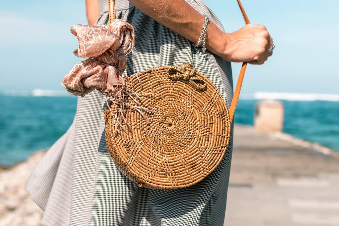 A woman holding a bag with a travelling tarot kit